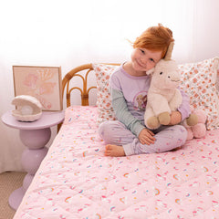 Rudie Baby waterproof fitted sheet styled on bed - potty training night protection for toddlers